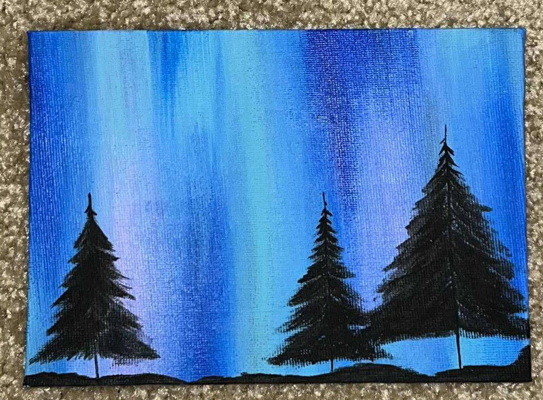 Pinetrees with aurora background